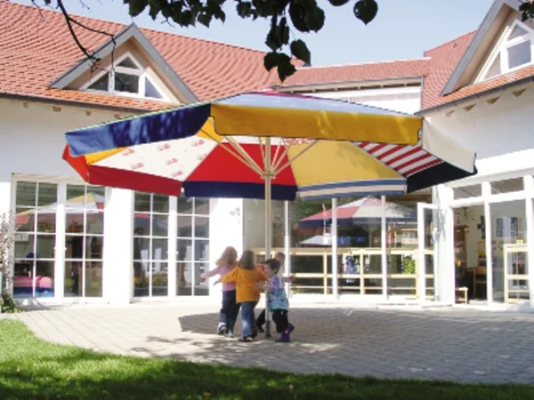 Schattello parasol with a multi coloured fabric scheme at an infant school